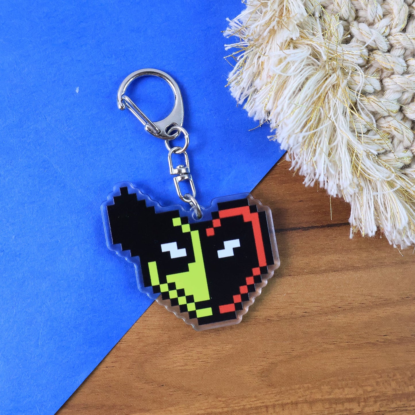 Backside view of acrylic pixel character keychain highlighting smooth edges