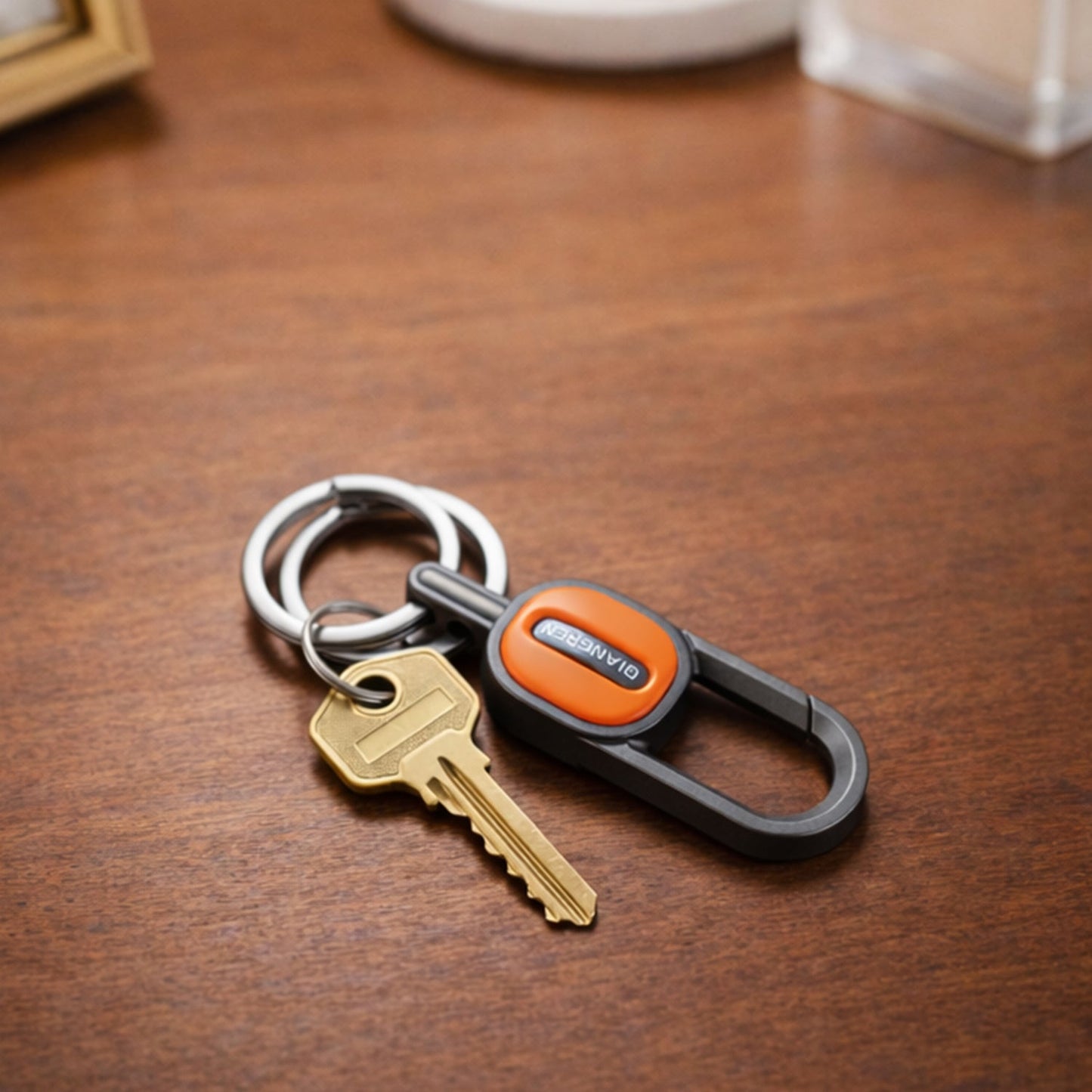 Stylish metal key holder clip attached to belt or backpack