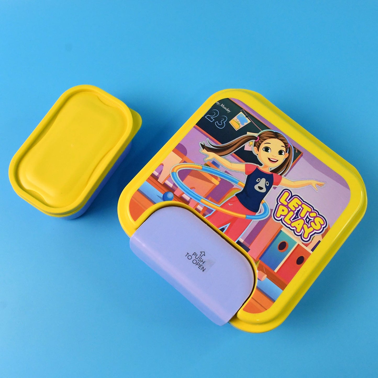 Open kids lunch box showing sections and accessories