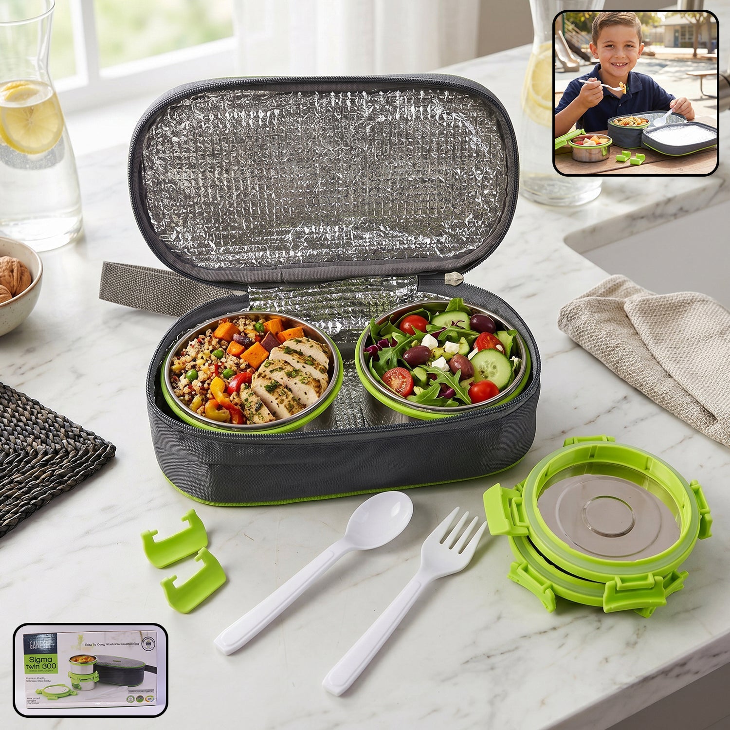 An open grey and lime green insulated lunch bag with two stainless steel containers filled with food, cutlery.