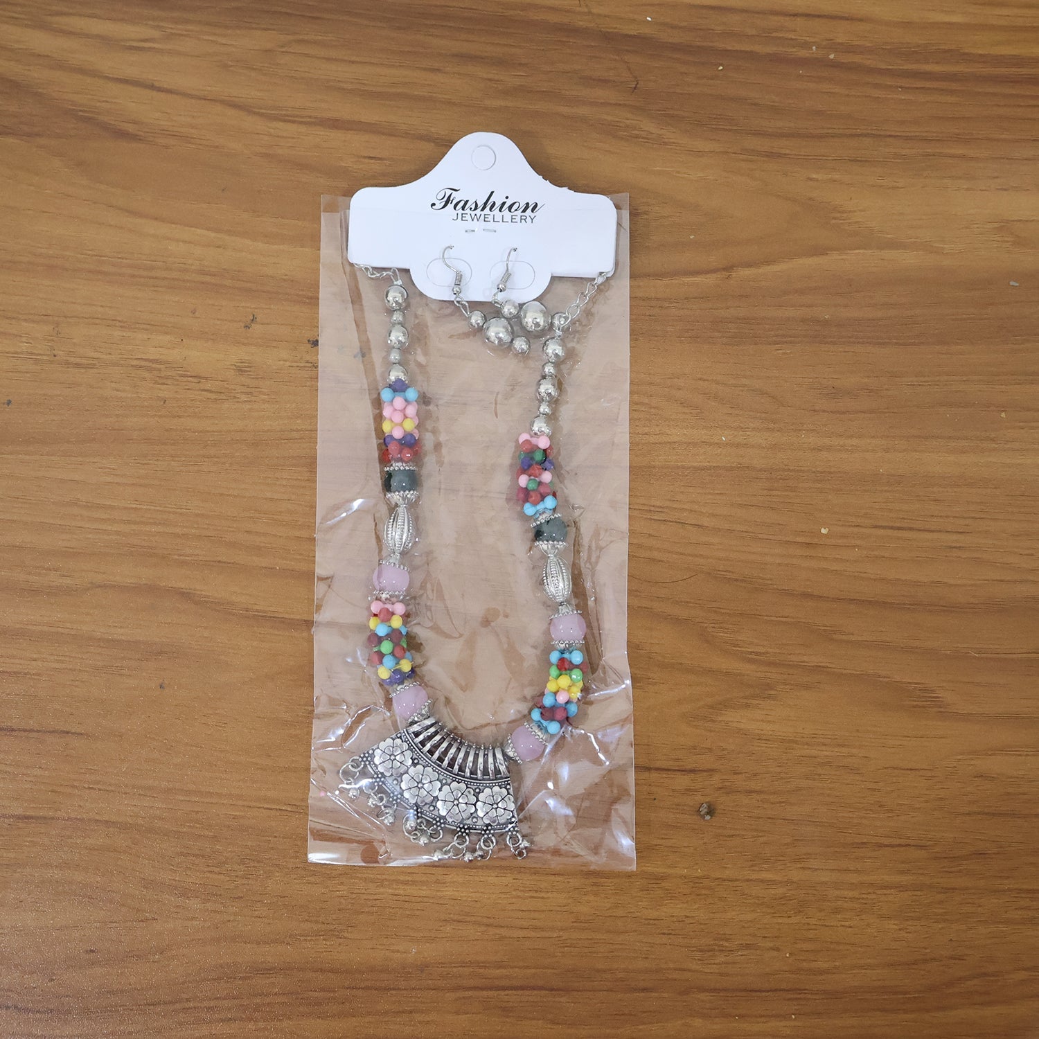 Model wearing vibrant oxidised multicolor beaded traditional necklace set