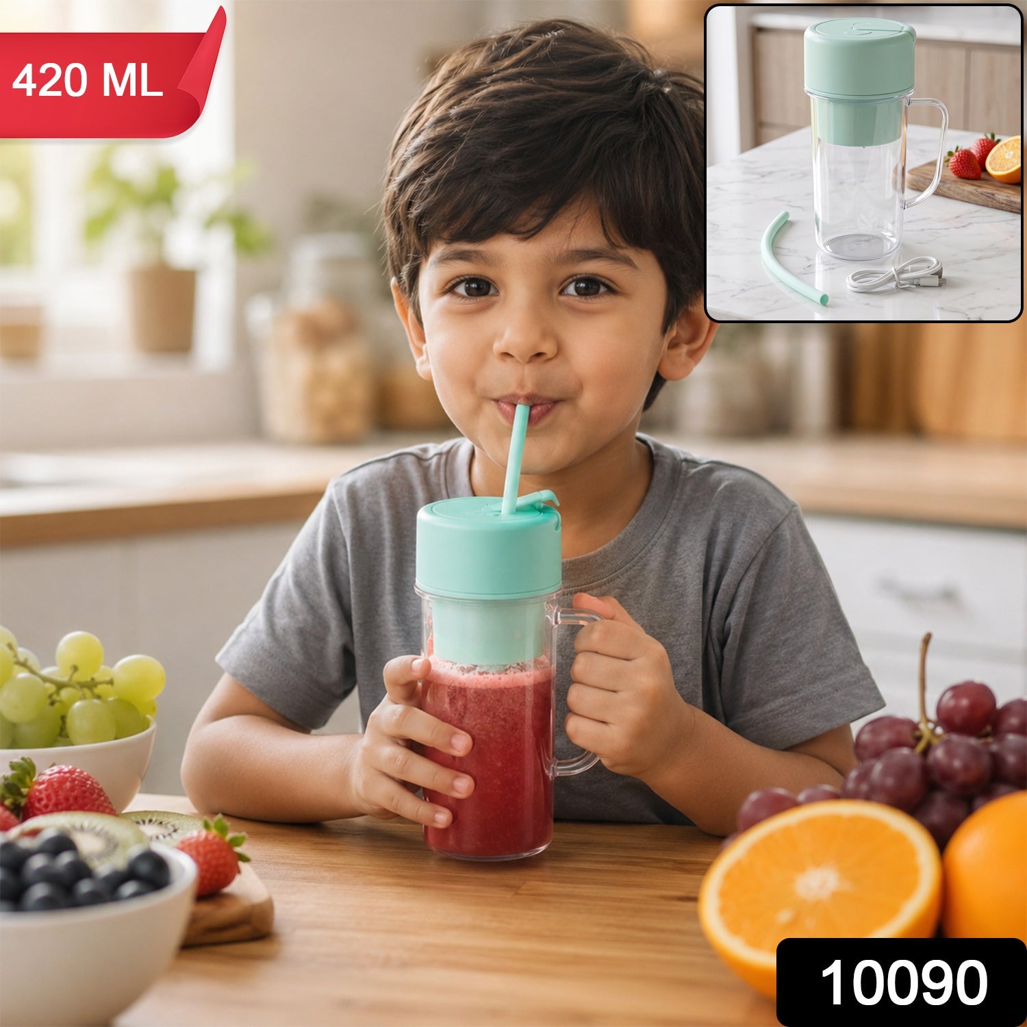 A young boy sips a red smoothie from a clear blender bottle with a mint green lid and straw in  kitchen setting.