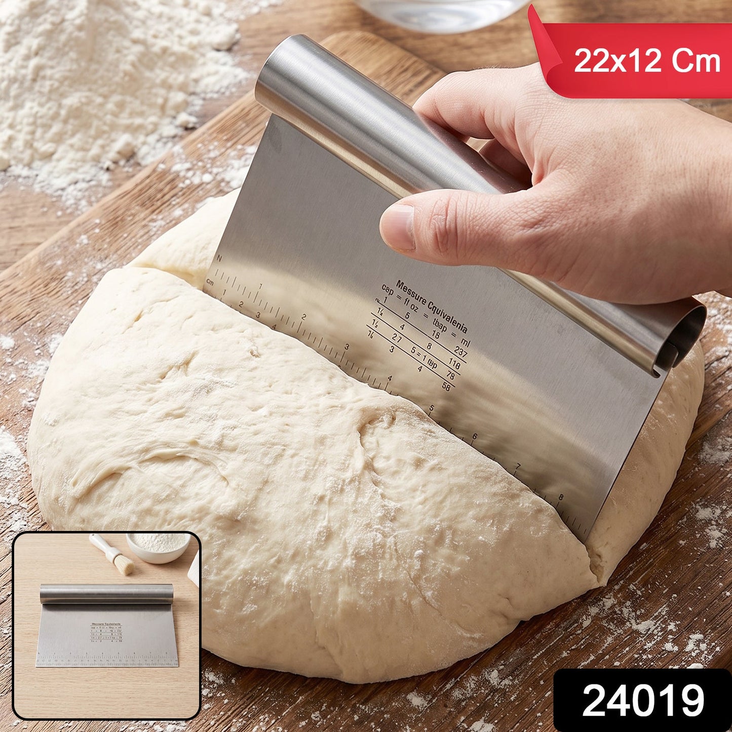 A hand uses a stainless steel dough scraper to divide a large round of dough on a wooden cutting board, with size and