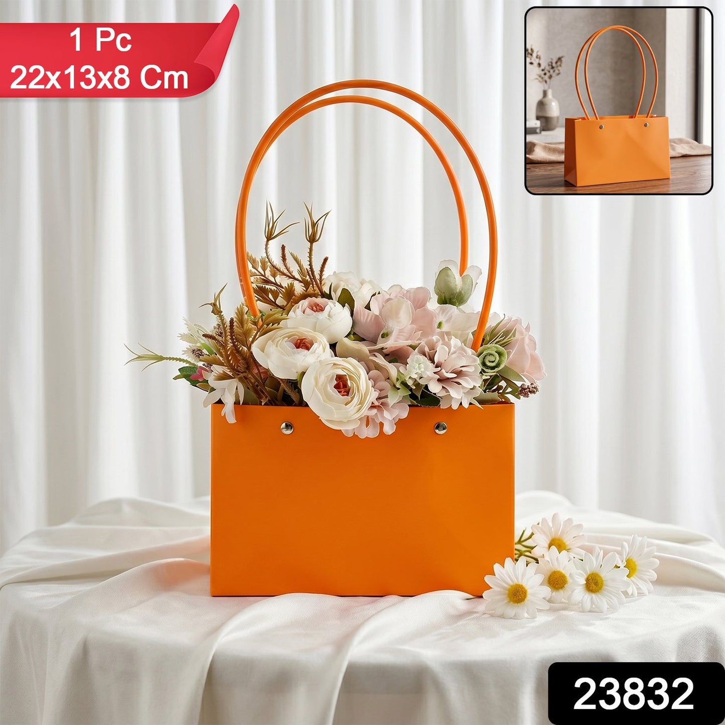 Orange flower gift bag with an artificial flower bouquet and decorative floral arrangement