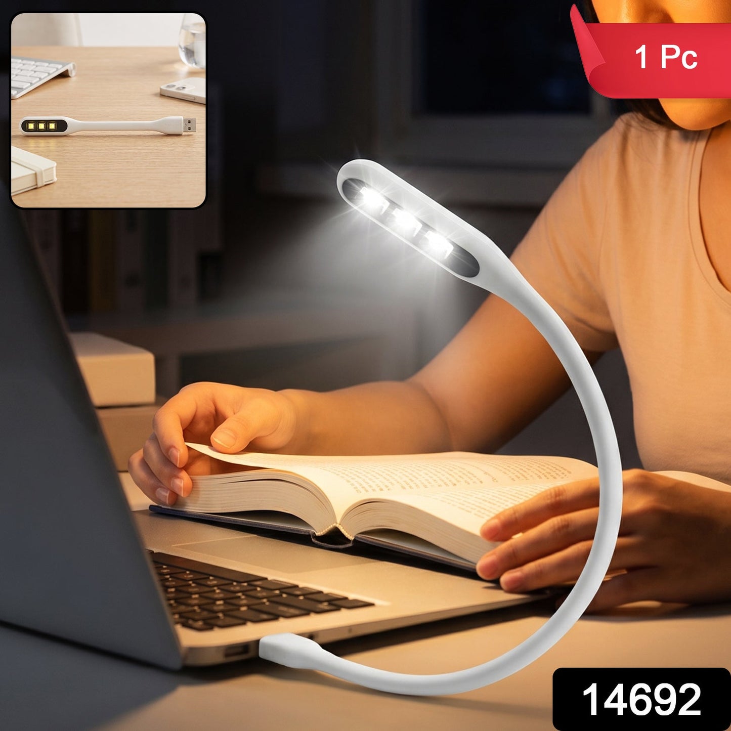 A person reading a book at night with a white flexible USB LED light plugged into a laptop, providing illumination.