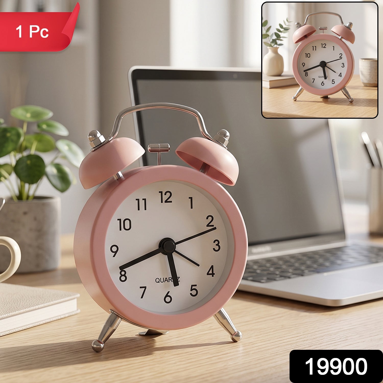 Pink twin bell alarm clock on a wooden desk with a laptop, plant, and a small inset image of the clock.