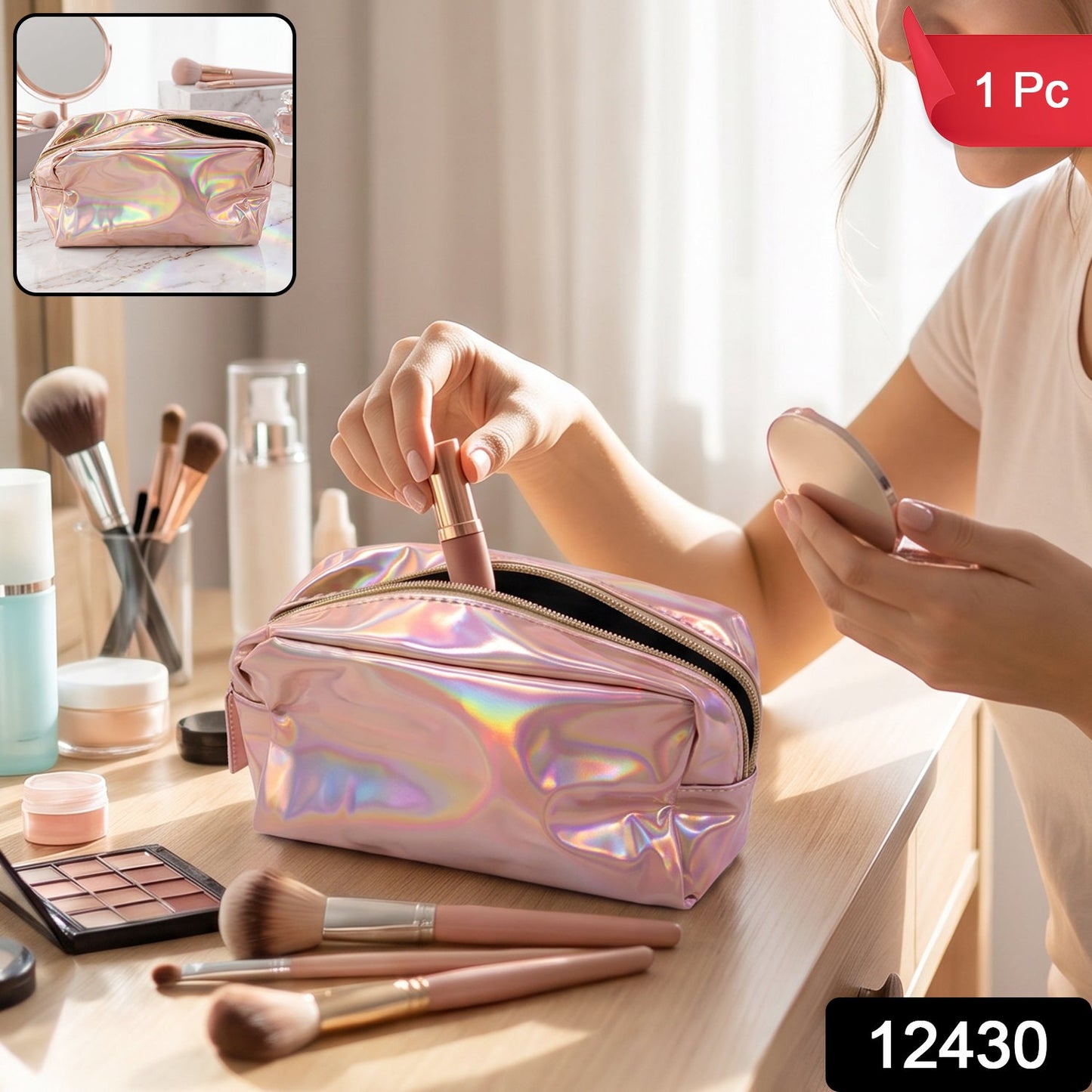 A shiny pink holographic bag with a gold zipper is open on a marble surface, surrounded by makeup brushes and a mirror.