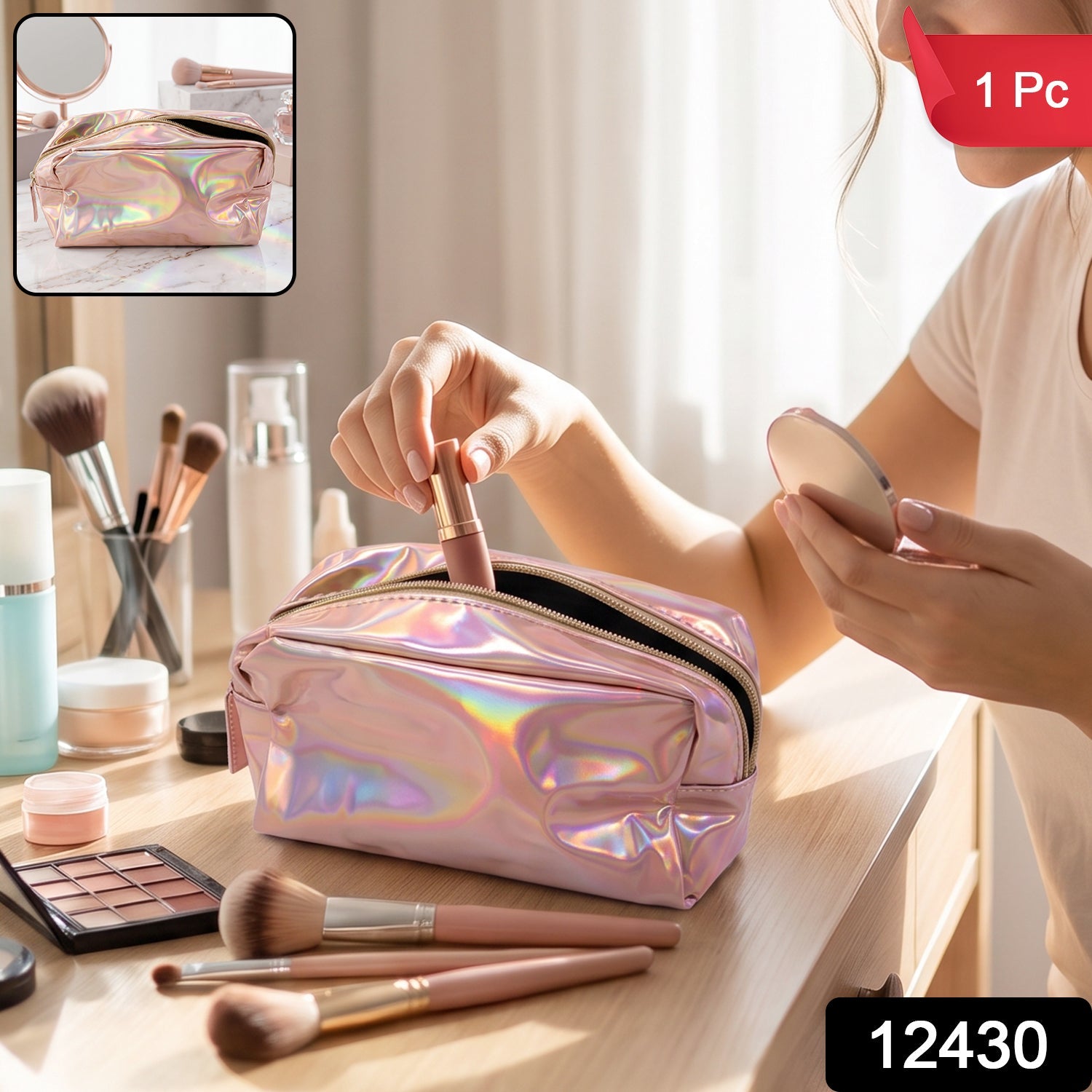 A shiny pink holographic bag with a gold zipper is open on a marble surface, surrounded by makeup brushes and a mirror.