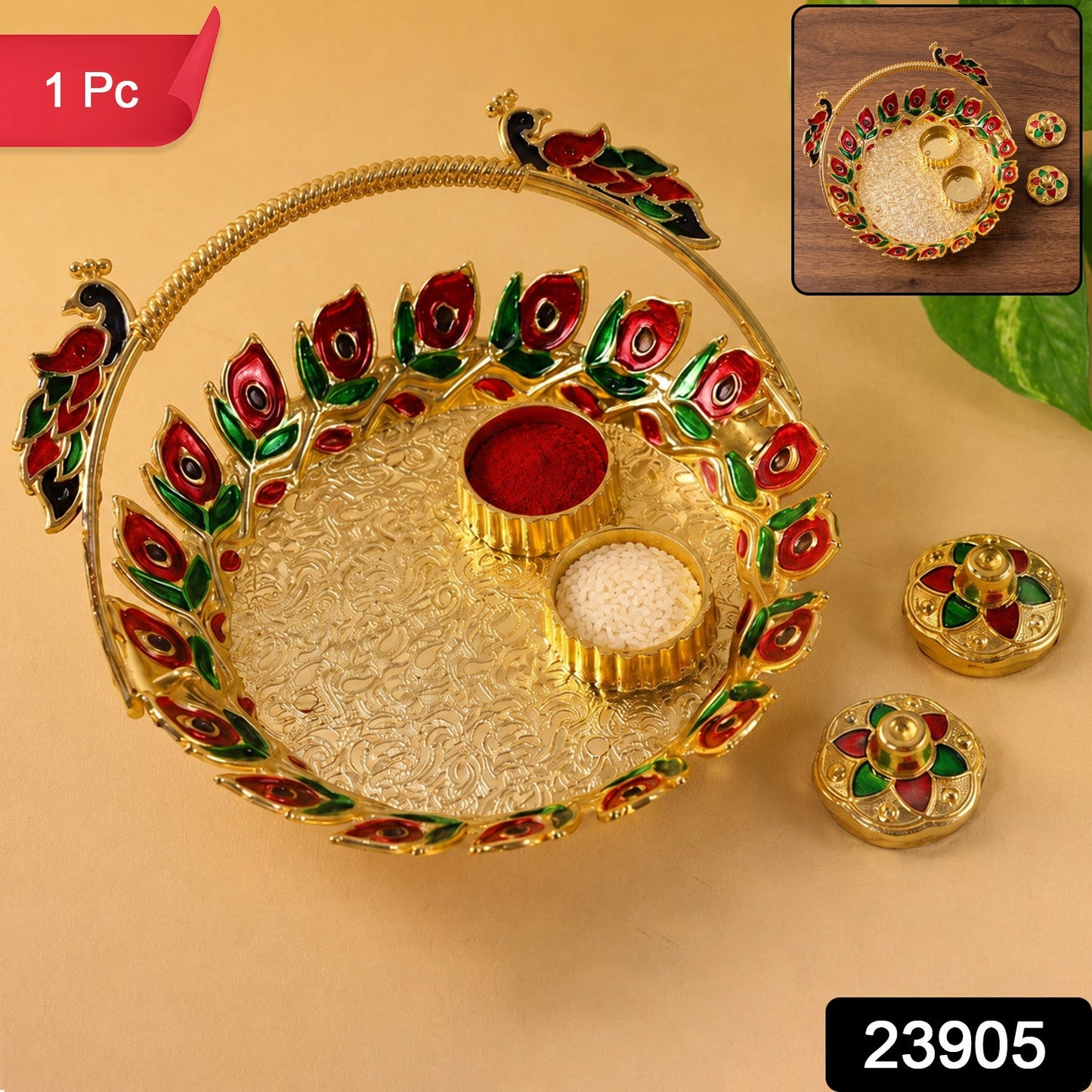 A golden kumkum dish with a peacock handle, holding red kumkum and white rice, with two matching lidded containers beside