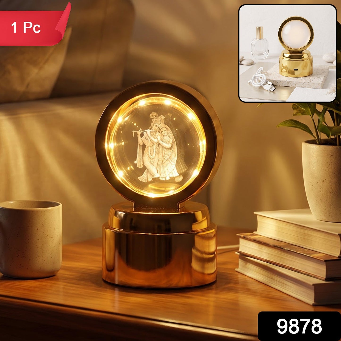 A golden Radhe Krishna 3D Crystal Ball LED Table Showpiece (1 Pc) with an illuminated crystal ball, on a wooden table.