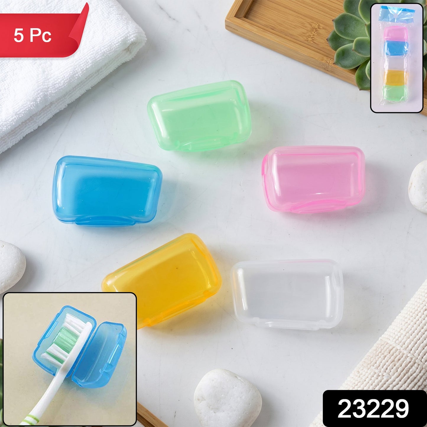 A white towel, green plant, and small stones surround five translucent toothbrush head covers in various colors.