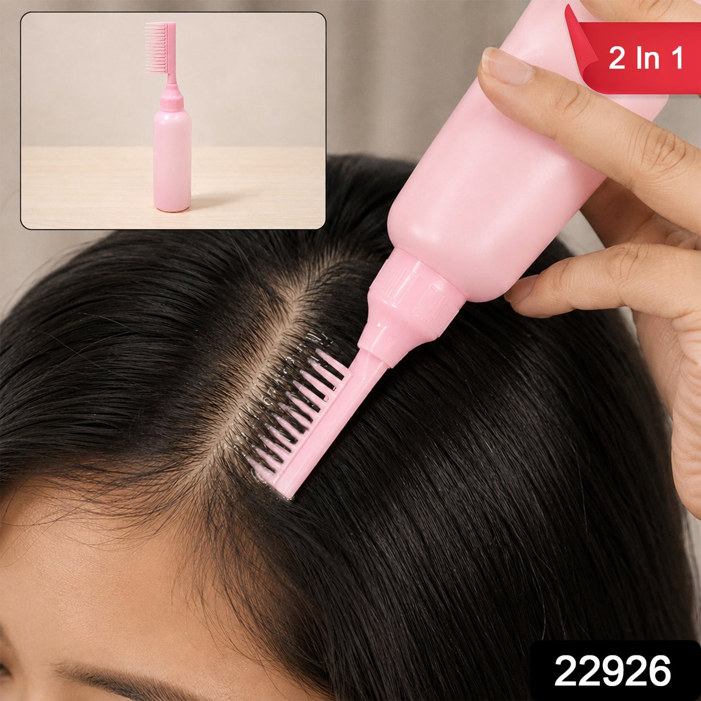 A pink 2 In 1 Hair Oil Applicator Bottle with Scalp Comb is held by a hand, applying product to a person's dark hair.
