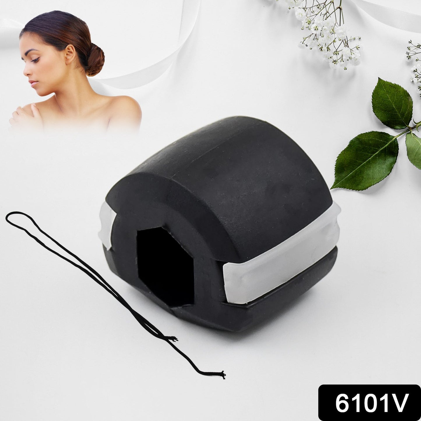 A black and white jaw exerciser with a black string attached, on a white background with a woman's face and leaves.