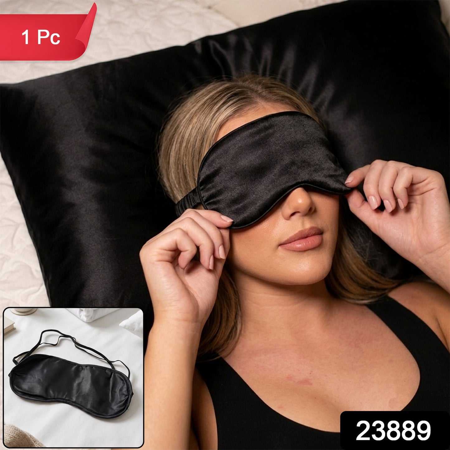 A woman with blonde hair wearing a black satin sleep mask, lying on a black satin pillow, with a small inset of the mask.