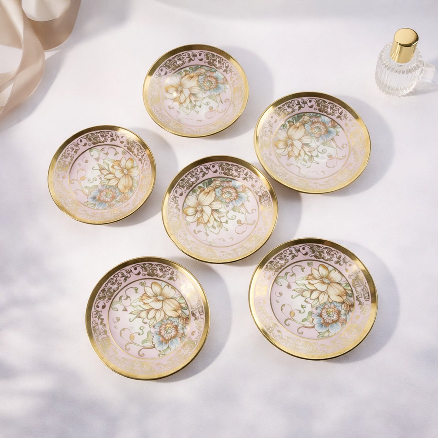 Matching porcelain tea cups with saucers in floral design